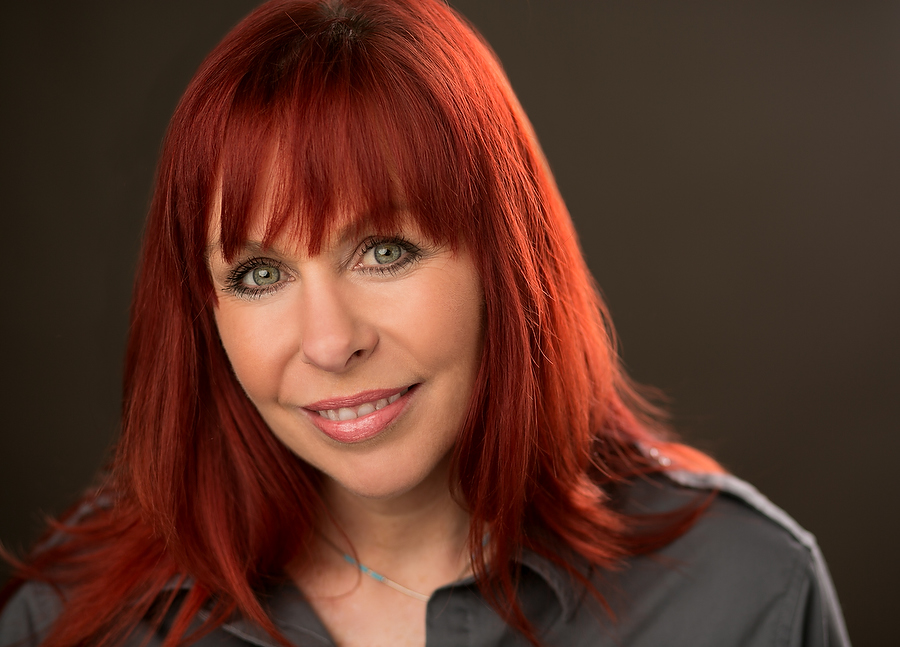 Headshot of  a lady with red hair 
